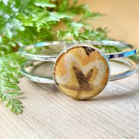 Vintage Tin Hinged Cuff Bracelet Under Resin- Mod Yellow Star Flower